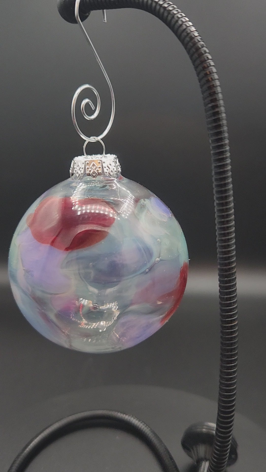 Iridescent Glass Ornament with Red Swirls