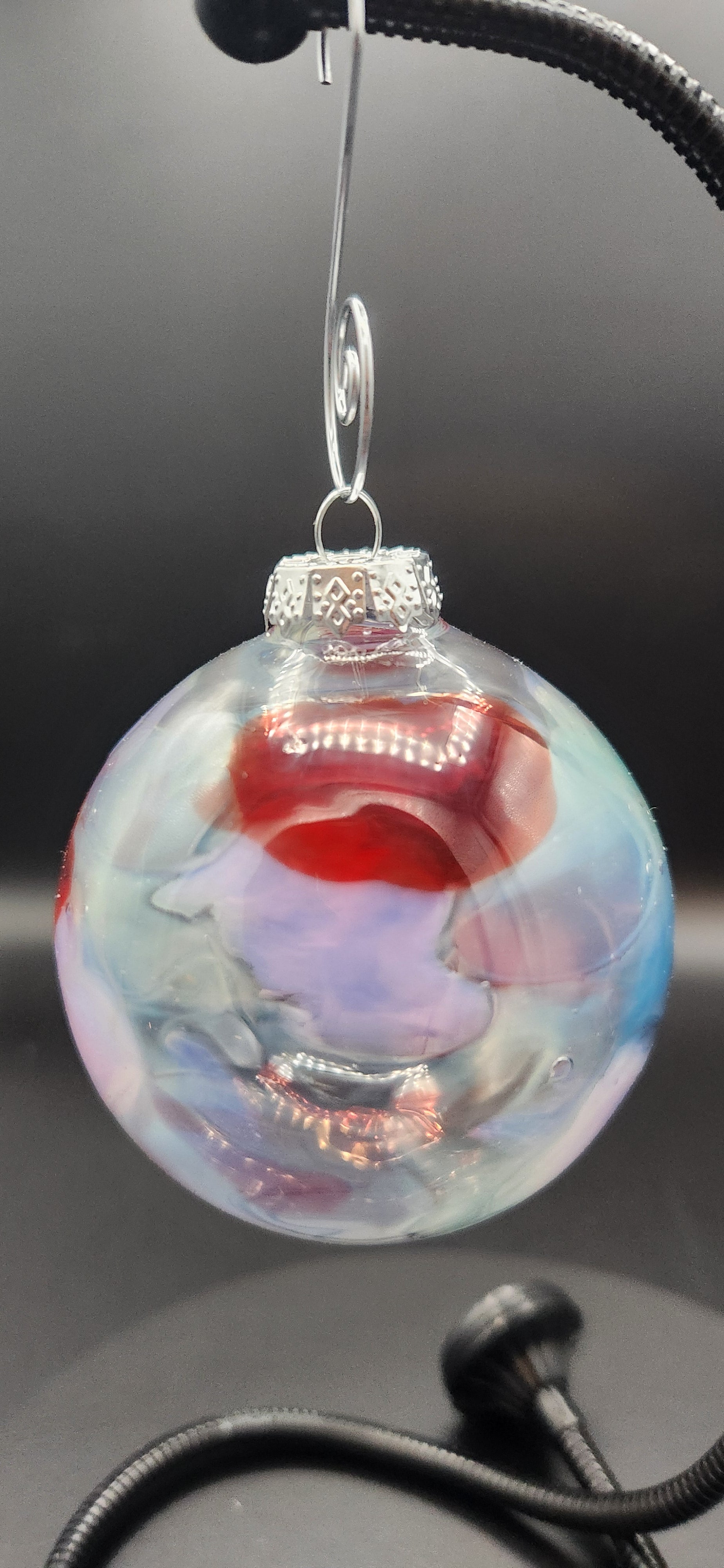 Iridescent Glass Ornament with Red Swirls