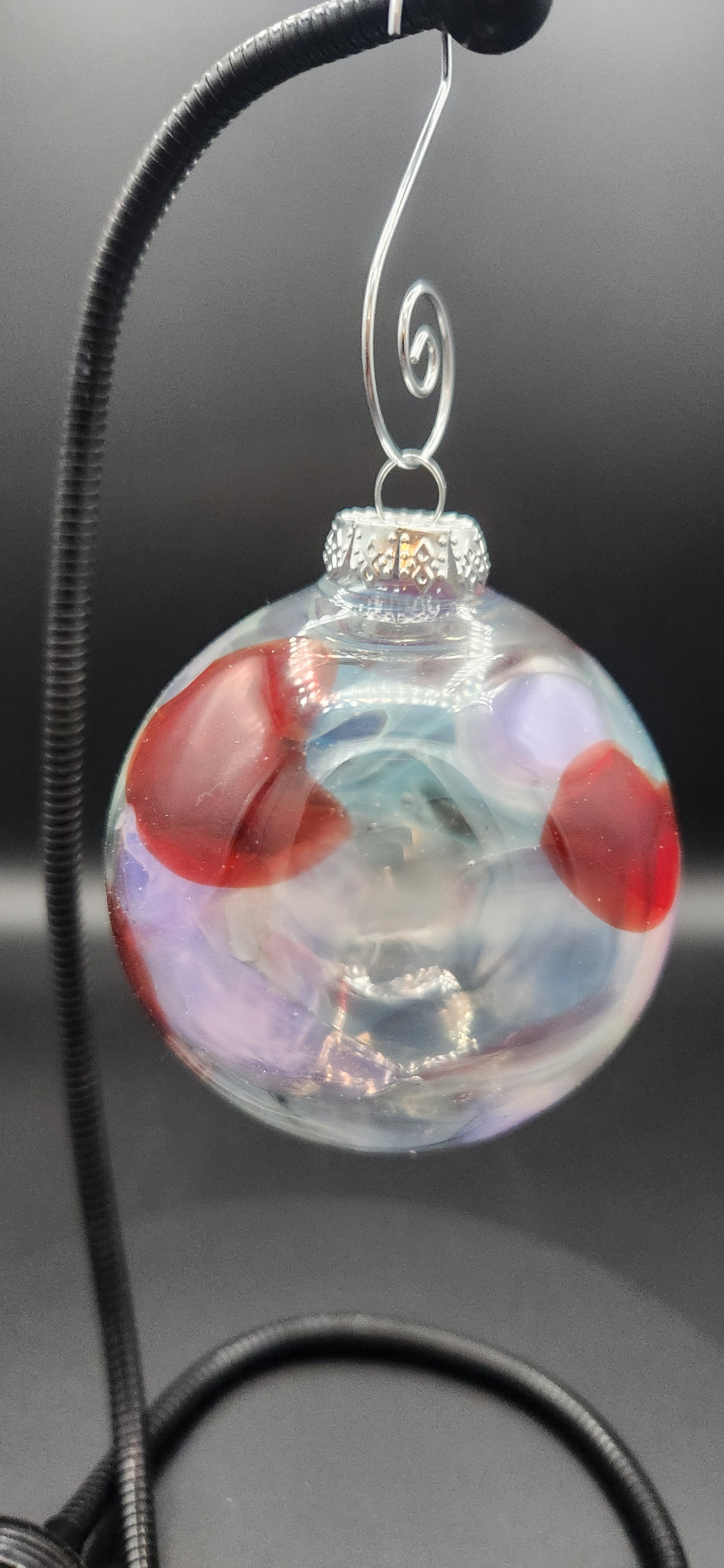 Iridescent Glass Ornament with Red Swirls